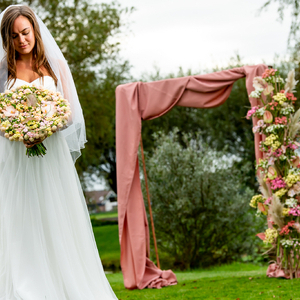 Decorate your wedding venue with a flower gazebo for the wedding ceremony. This gazebo is simple and custom made with copper tubing and decorated with a beautiful soft colored fabric. The flower piece is made with a structure of metal frame which is welde